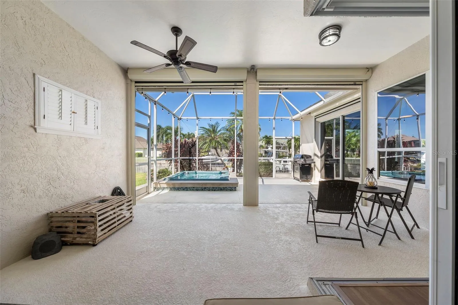 A spacious covered lanai offers an inviting spot for morning coffee, casual meals, and relaxing after a day on the water.