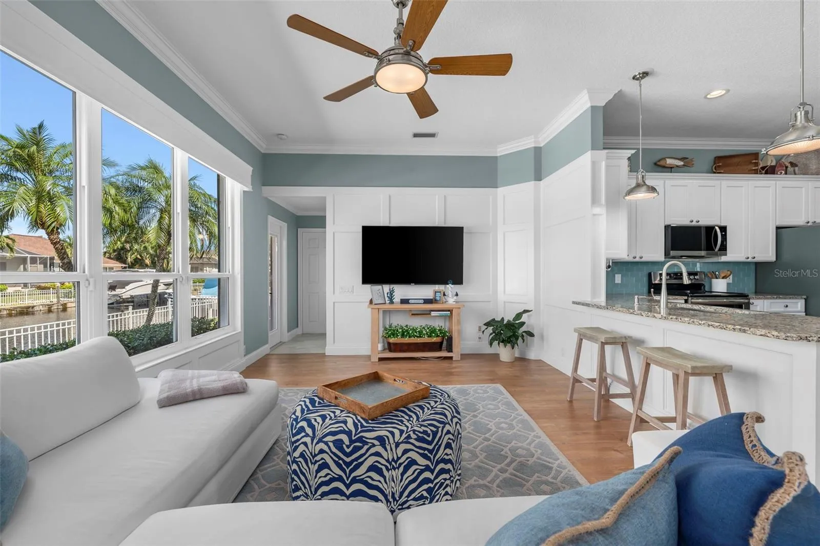 Enjoy canal views from the living area, with breakfast-bar seating keeping everyone connected to the kitchen.