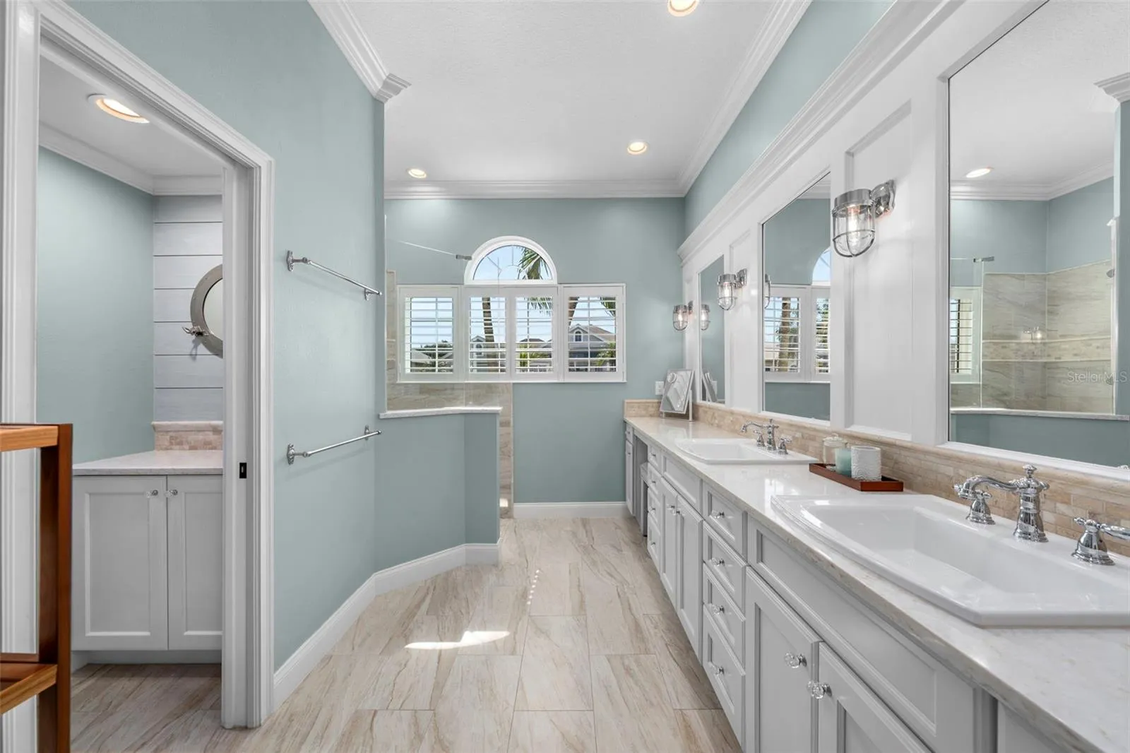Beautifully renovated with a spacious vanity, soft coastal colors, and natural light for a calming start to the day.
