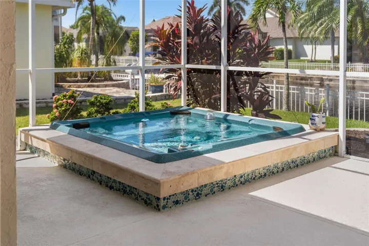 Unwind in your heated spa, surrounded by tropical greenery and peaceful canal views.