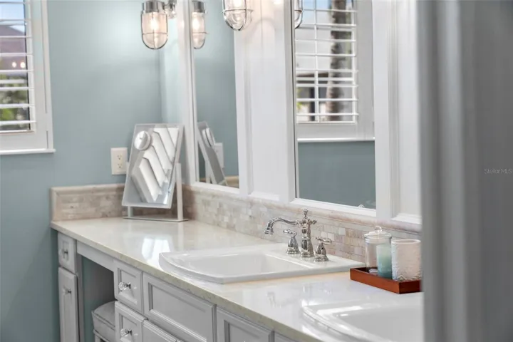 Elegant finishes and a dedicated seated vanity bring thoughtful comfort to your morning routine.
