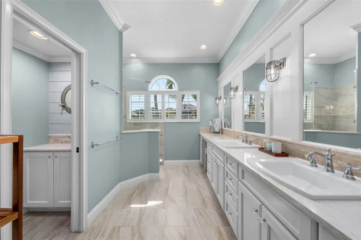 Beautifully renovated with a spacious vanity, soft coastal colors, and natural light for a calming start to the day.