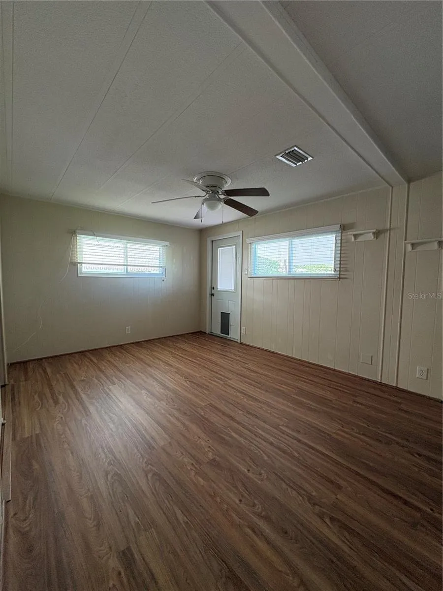 Primary bedroom/rear entry/exit to back porch