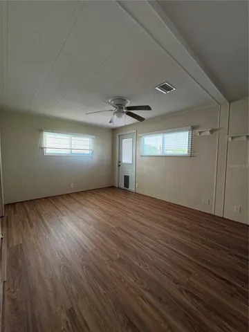 Primary bedroom/rear entry/exit to back porch