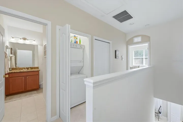 Stack washer/dryer off hallway