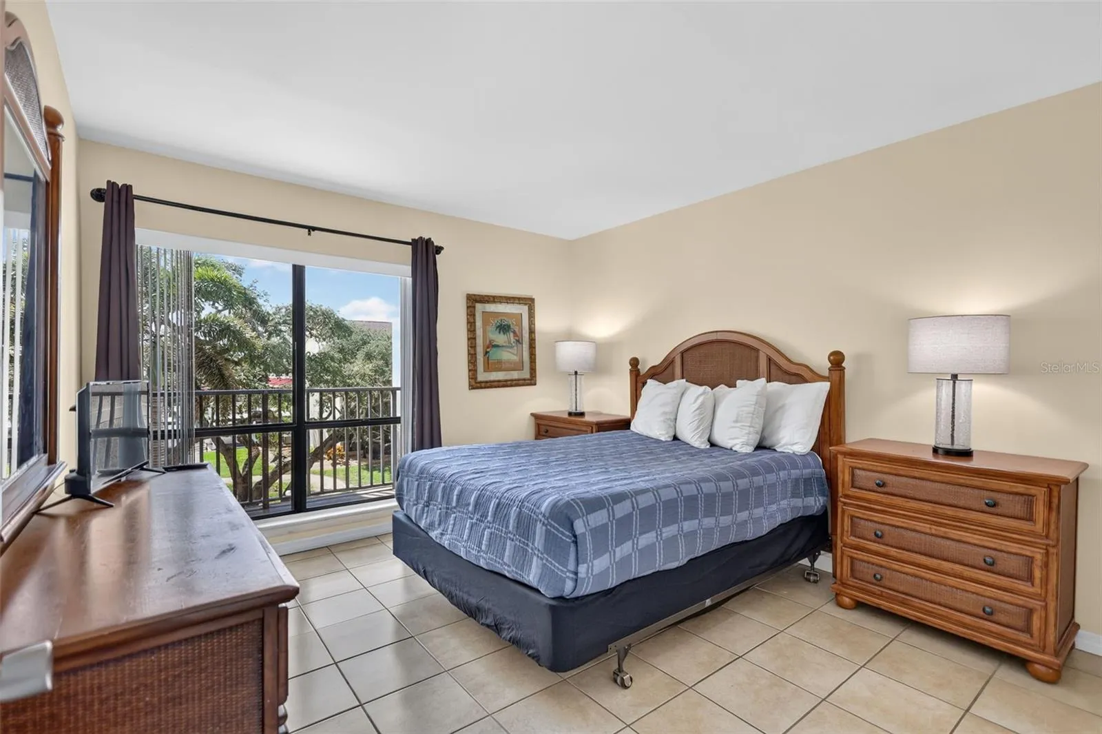 Large guest bedroom with ample natural light and spacious layout.