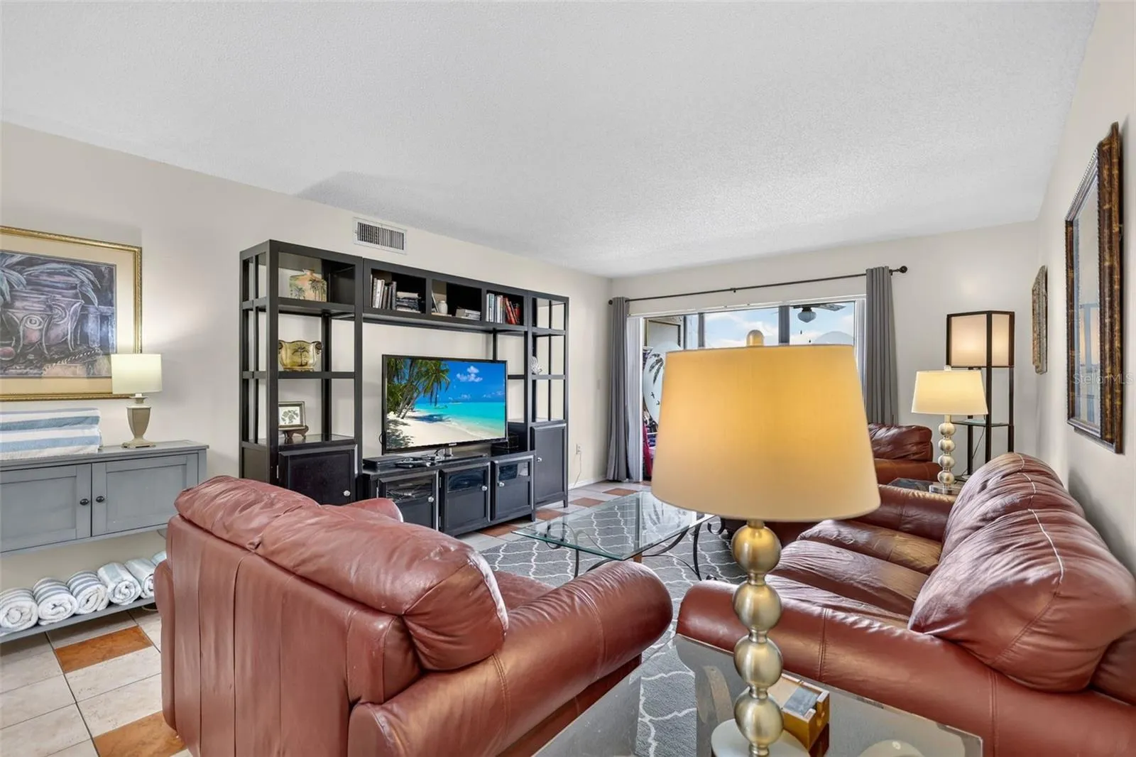 Spacious living room featuring an open-concept layout and a dedicated entertainment area.