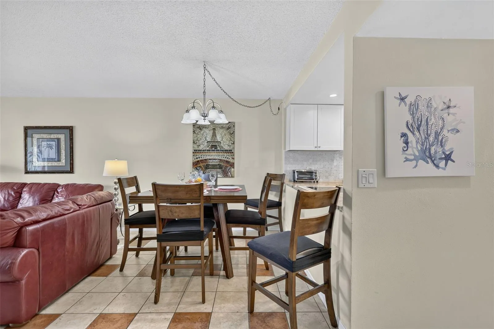 This dining area features a versatile table that expands to comfortably accommodate up to 8 guests.