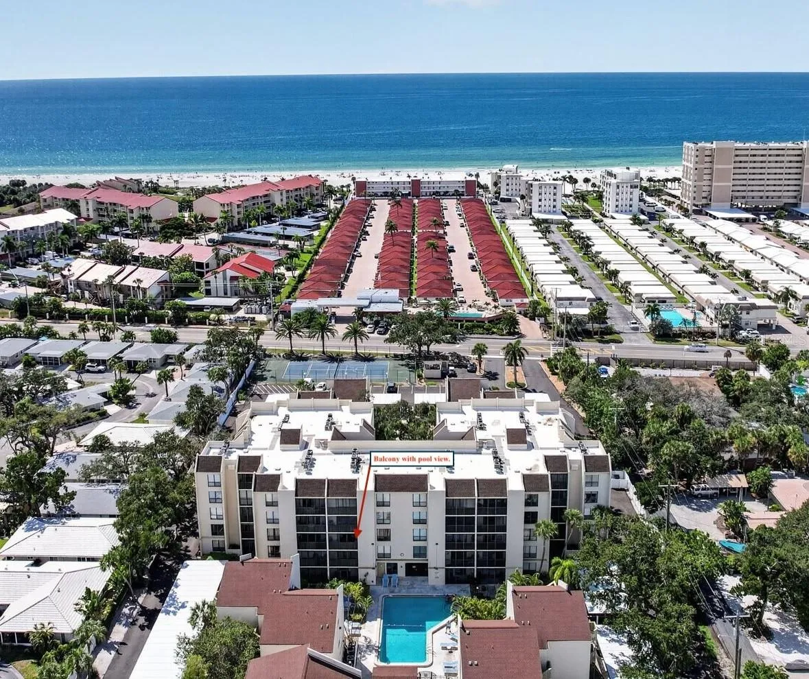 Arrow shows balcony with view overlooking the community pool.