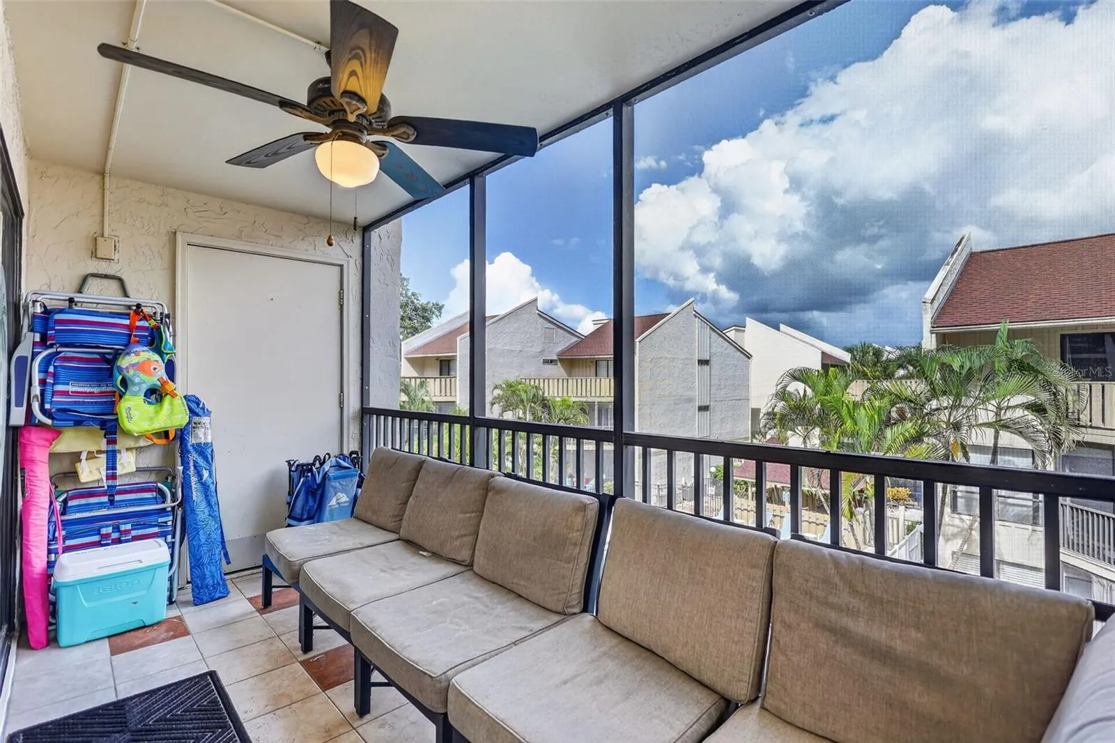 Spacious balcony featuring ample seating and dedicated storage space for the included beach toys.