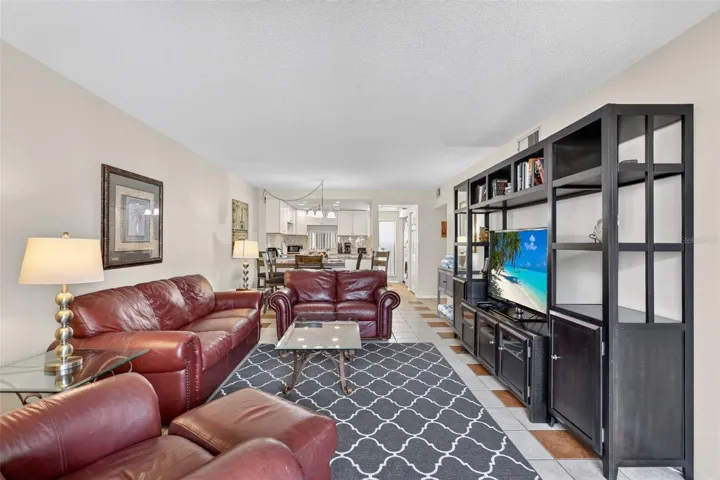 Beautifully renovated open-concept living room, dining area, and kitchen.