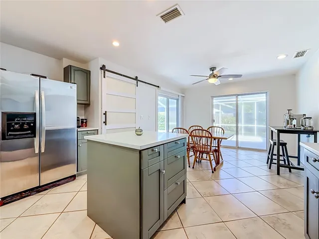 Kitchen - Dining Room - Outdoor Living and Pool Area