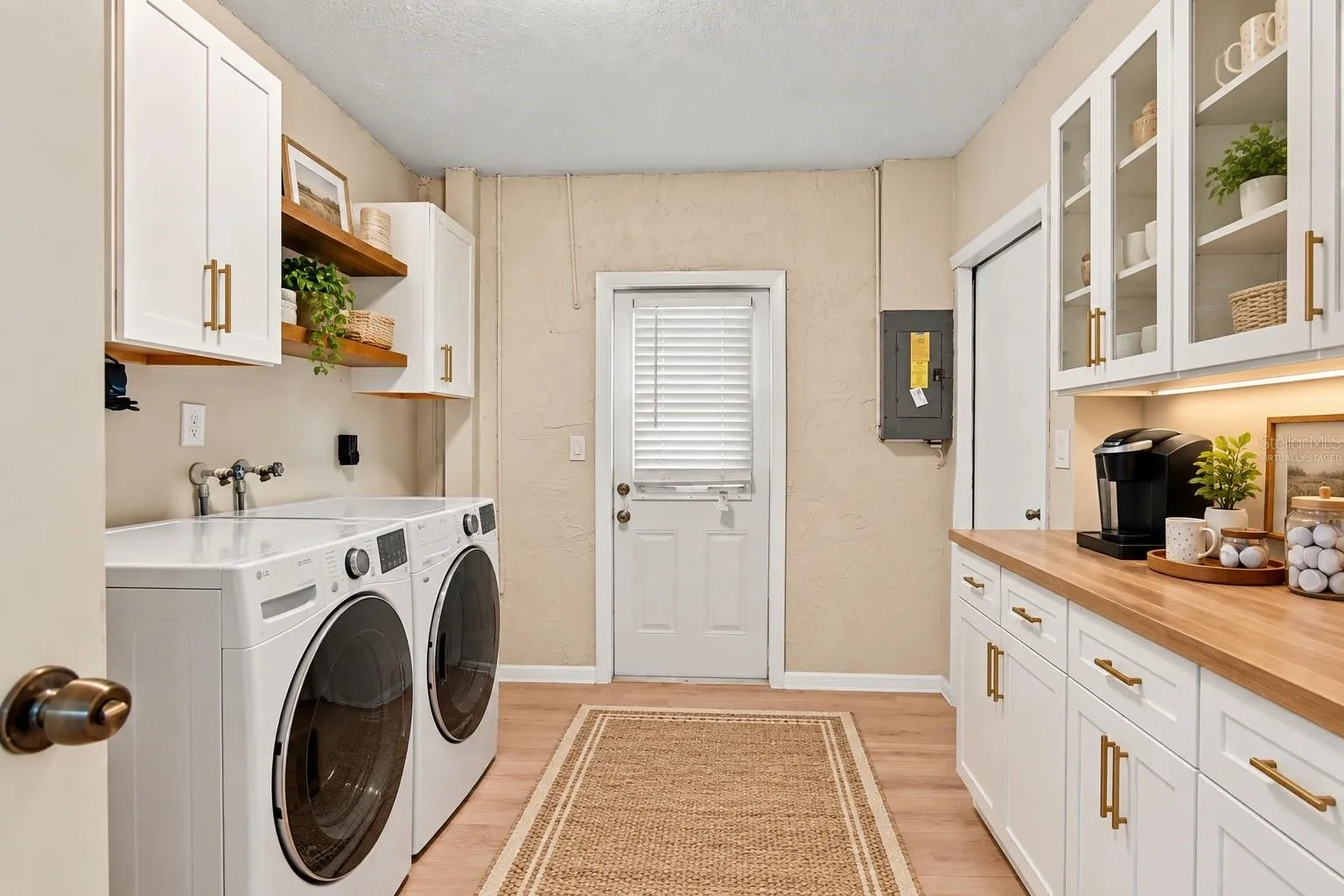 virtually staged laundry room with added cabinetry