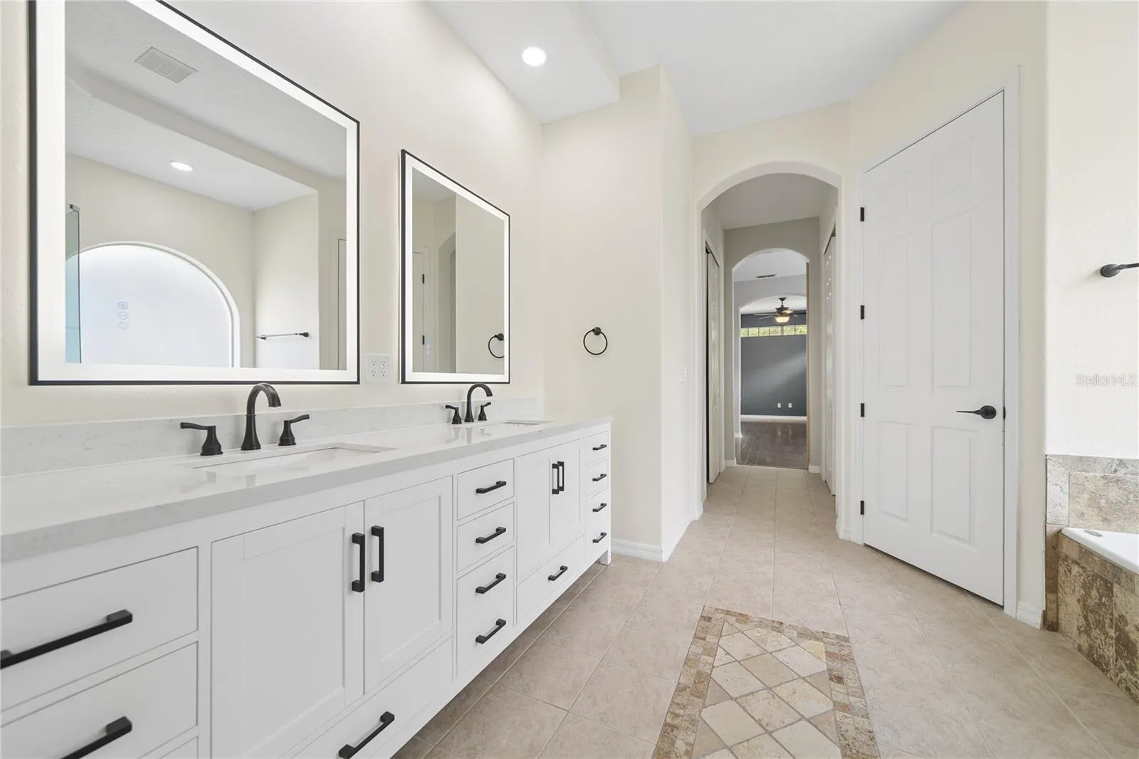 Walk past the two walk-in closets and into your primary bathroom with a water closet for your privacy.