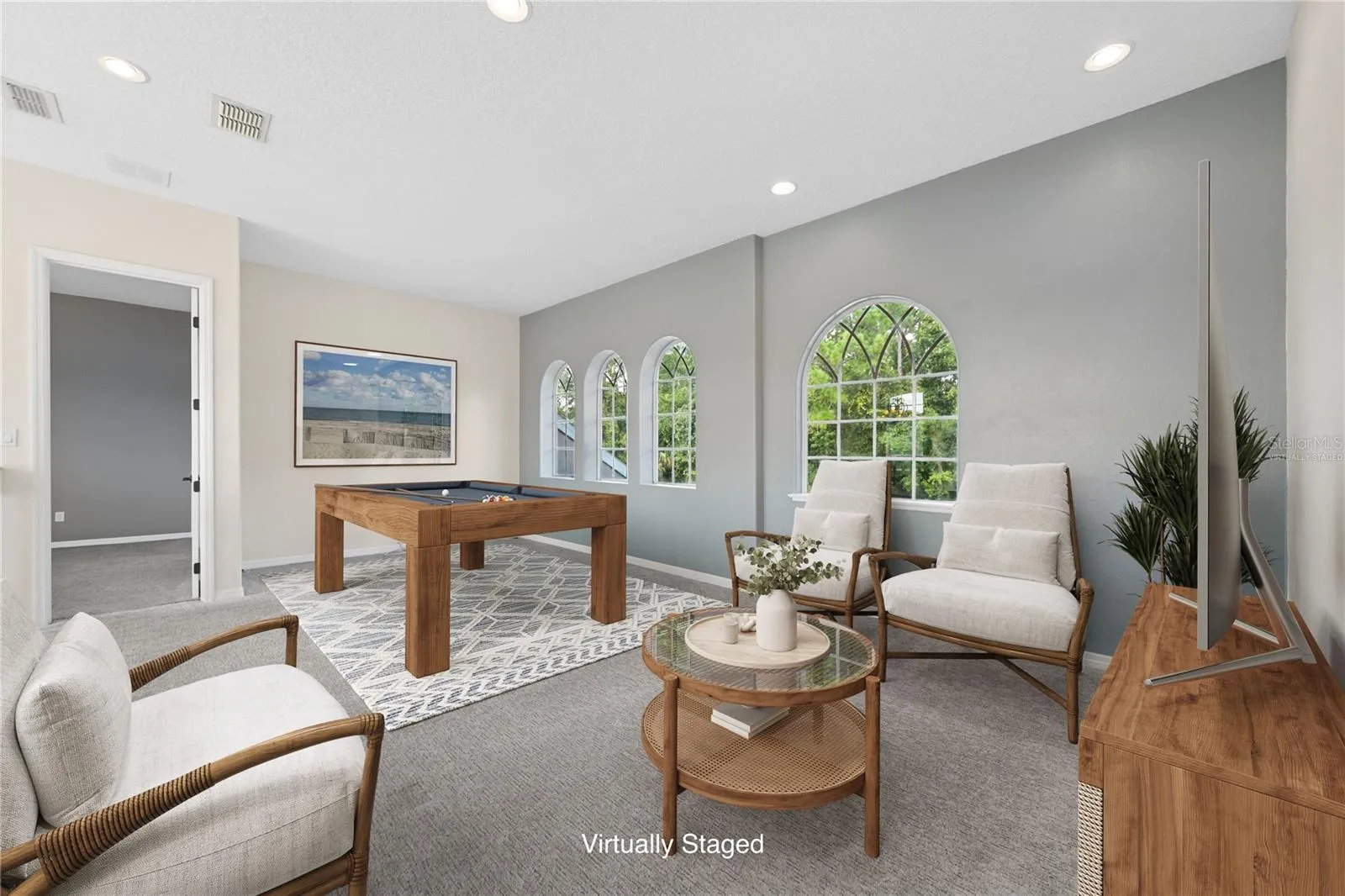 Now onto the 2nd floor, starting with this amazing game room or flex space at the top of the grand staircase for you to do with as you choose (photo virtually staged).