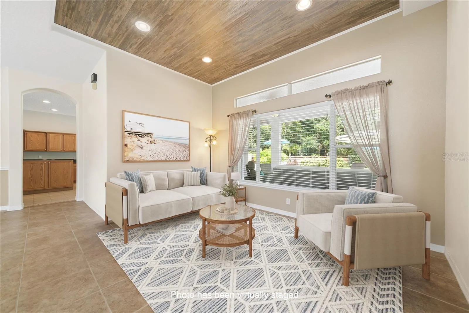 Directly in front of you when you walk in will be the formal living space (photo virtually staged).