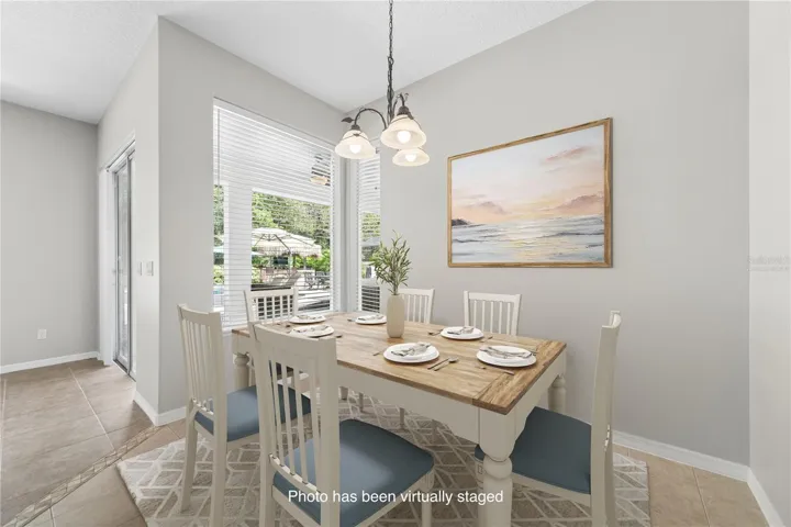 Here is the quaint breakfast nook or if you prefer a dinette for your family or smaller gatherings (photo virtually staged).
