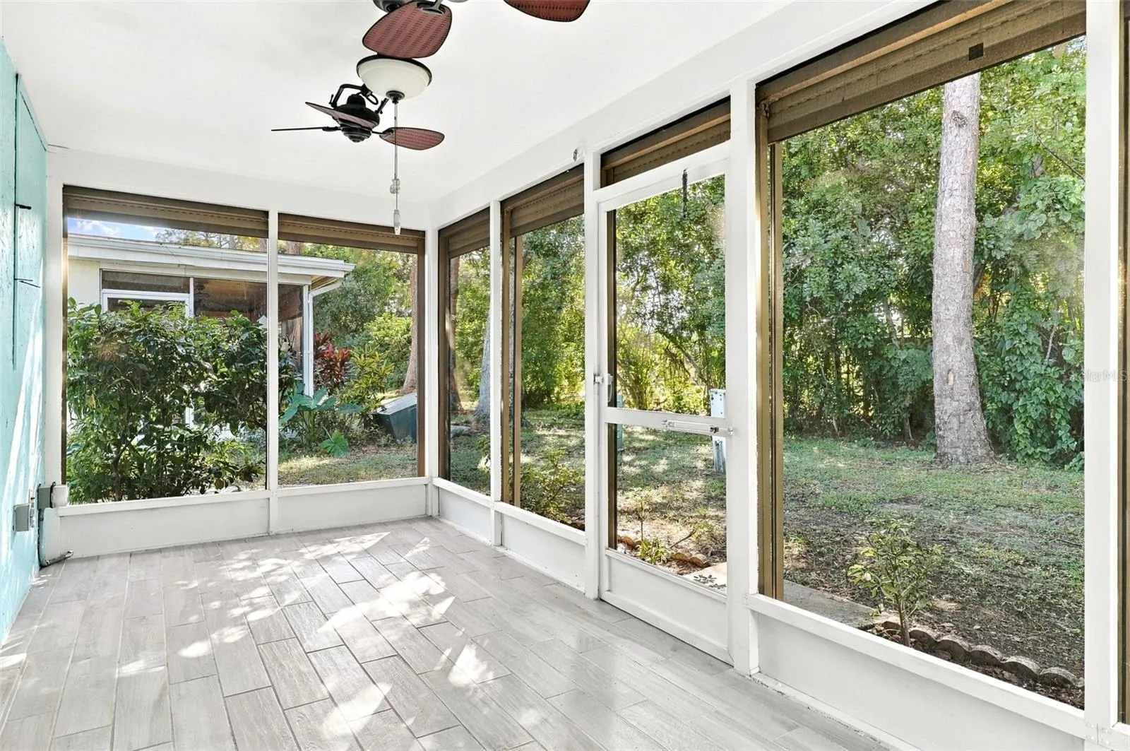 Lanai with motorized roll-down shutters