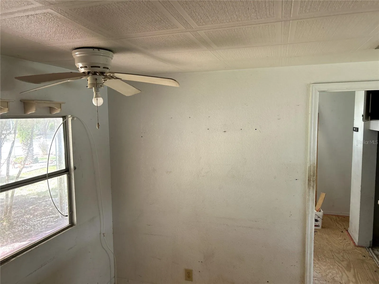 dining area in kitchen looking into bedroom 2 and living area.