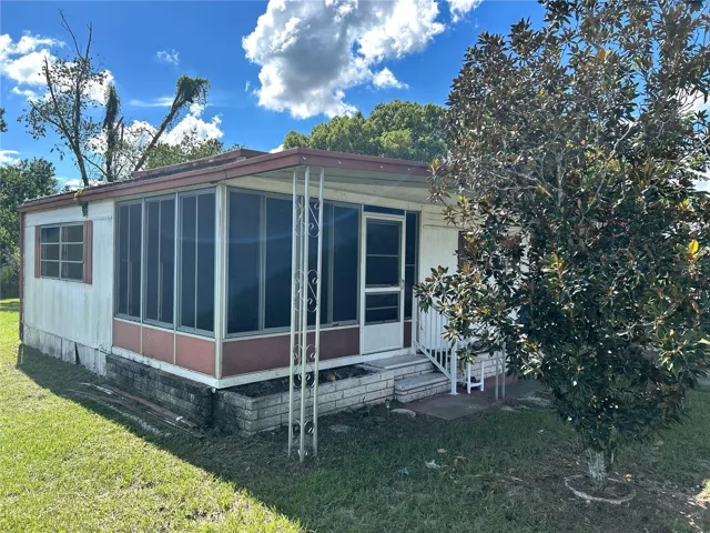 view of screened porch and living room.