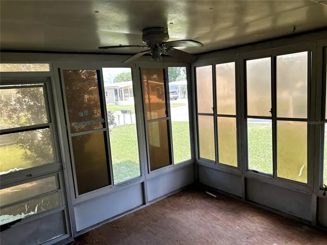 Screened porch with sliding doors into living area.