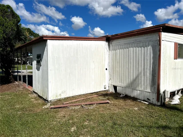 back view of utility/ laundry room and primary bedroom.