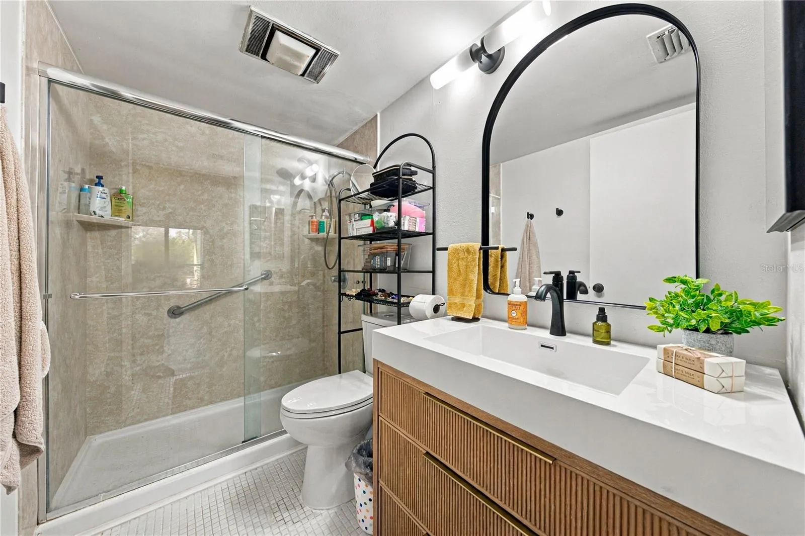 Remodeled Primary Suitewith Large Standing Shower, Glass BiPass Doors and Beautiful Vanity with Great Storage