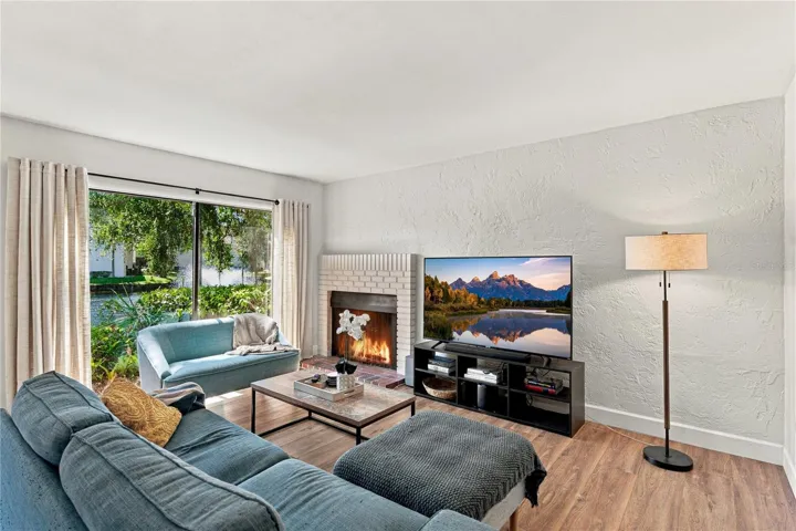Charming Living Room Area with Beautiful Wood Burning Fireplace