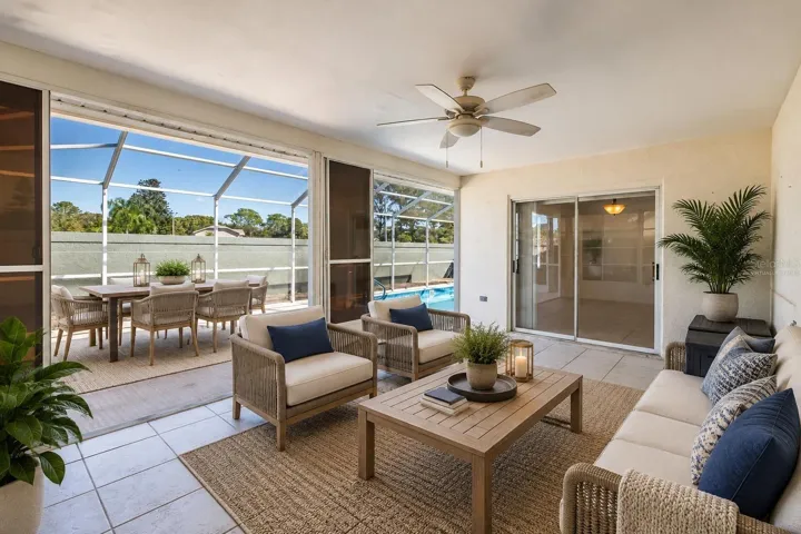 Virtually Staged Covered lanai leading out to pool