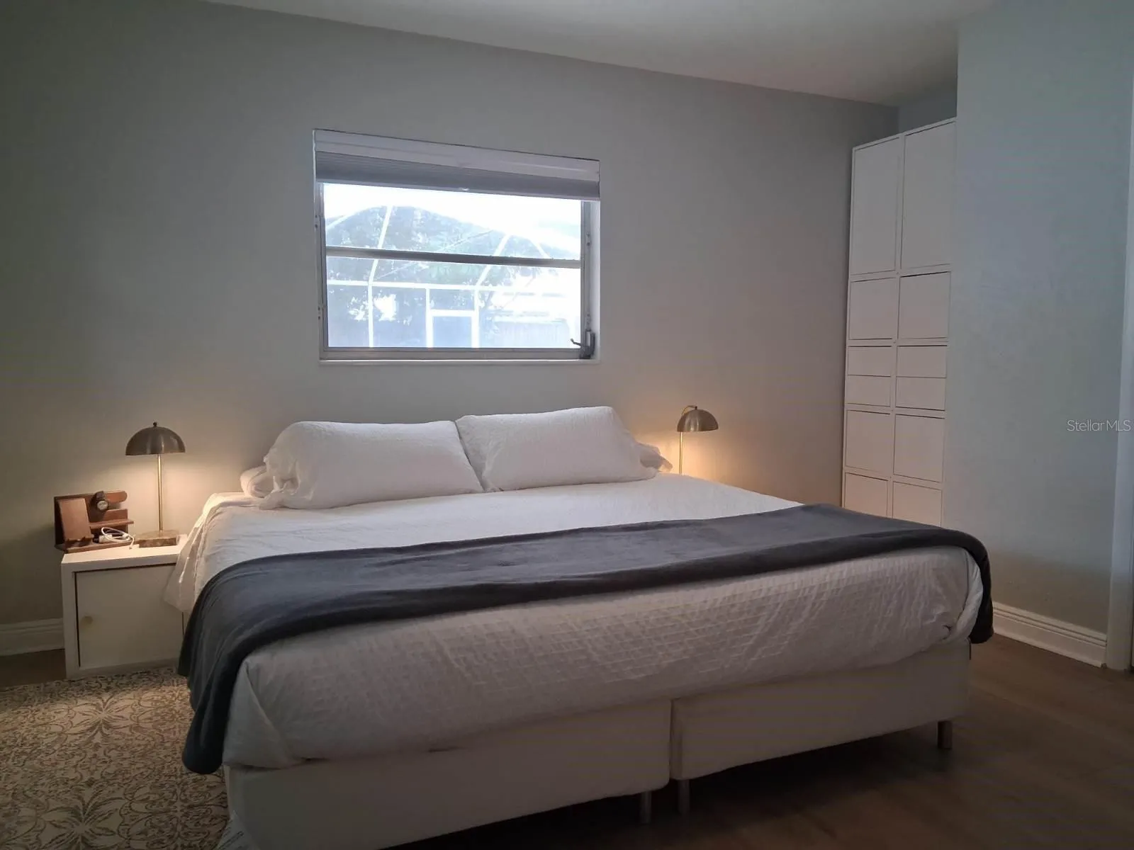 Primary Bedroom with a view out to the pool