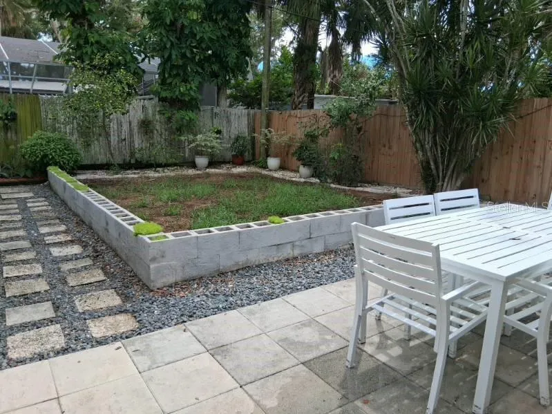 Newer drainage and landscaping in backyard; the key lime trees are next to the back fence
