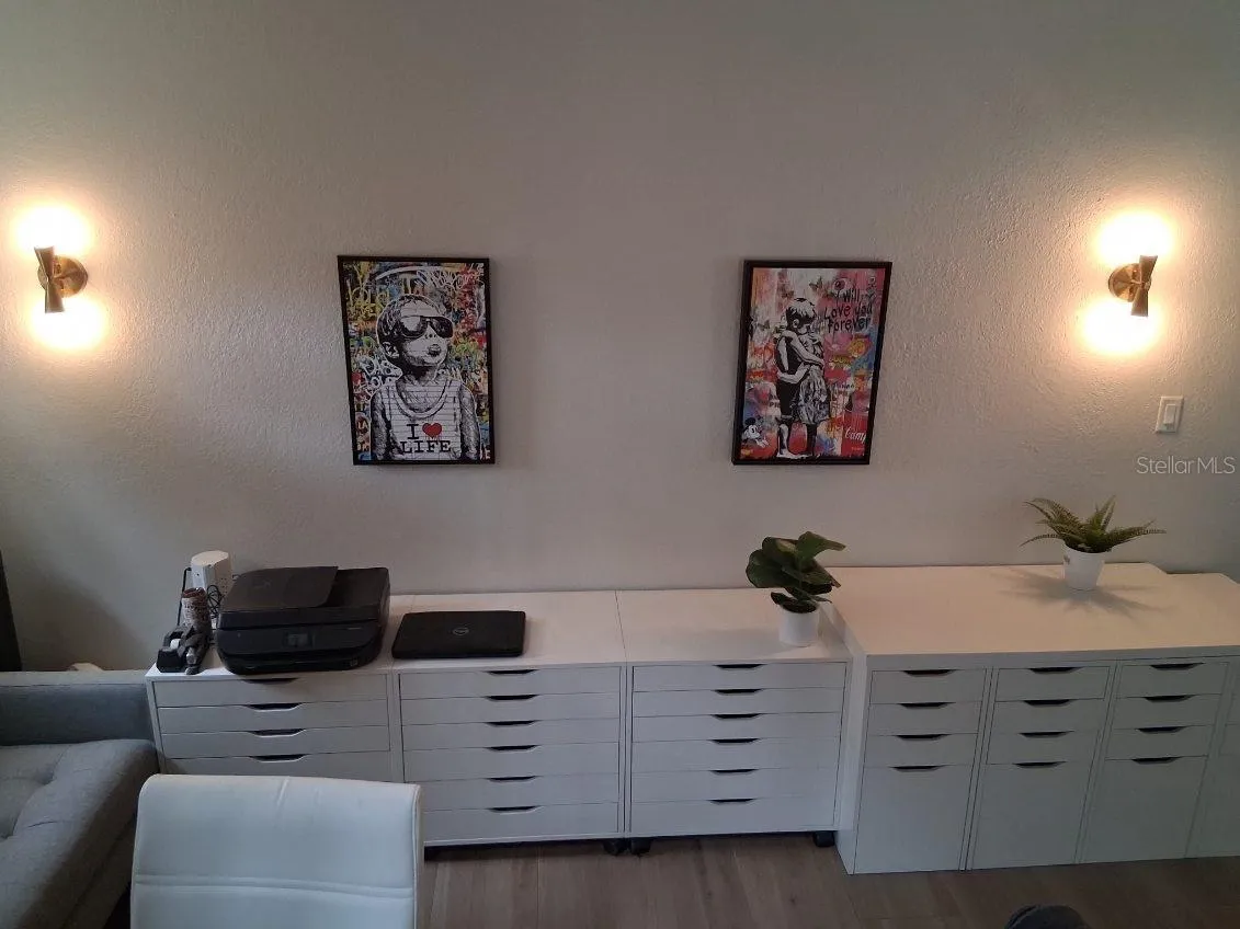 Custom gold-tone sconces in Office area