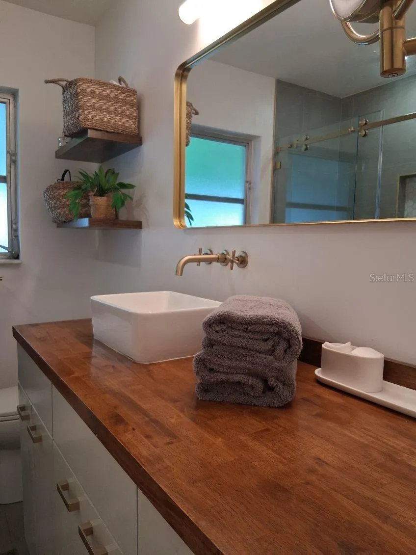 First Floor Guest Bathroom--these cabinets pull out and have custom shelving inside with lots of cubbies for storage