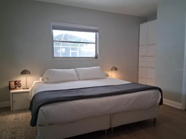 Primary Bedroom with a view out to the pool