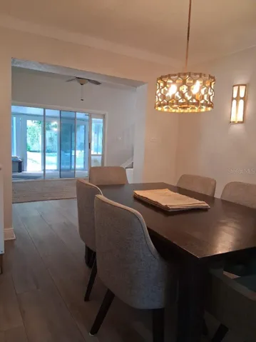 View from Dining Room to sliders out to the Sunroom