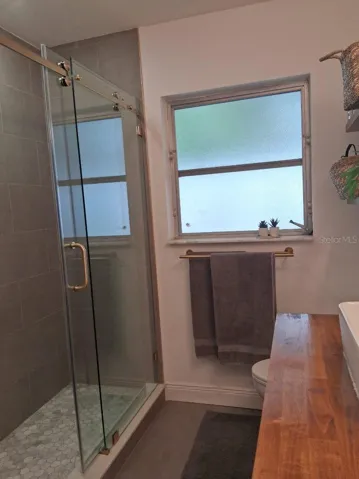 Newly remodeled shower with sliding glass doors