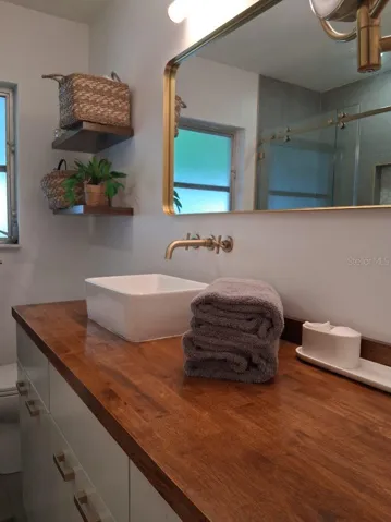 First Floor Guest Bathroom--these cabinets pull out and have custom shelving inside with lots of cubbies for storage