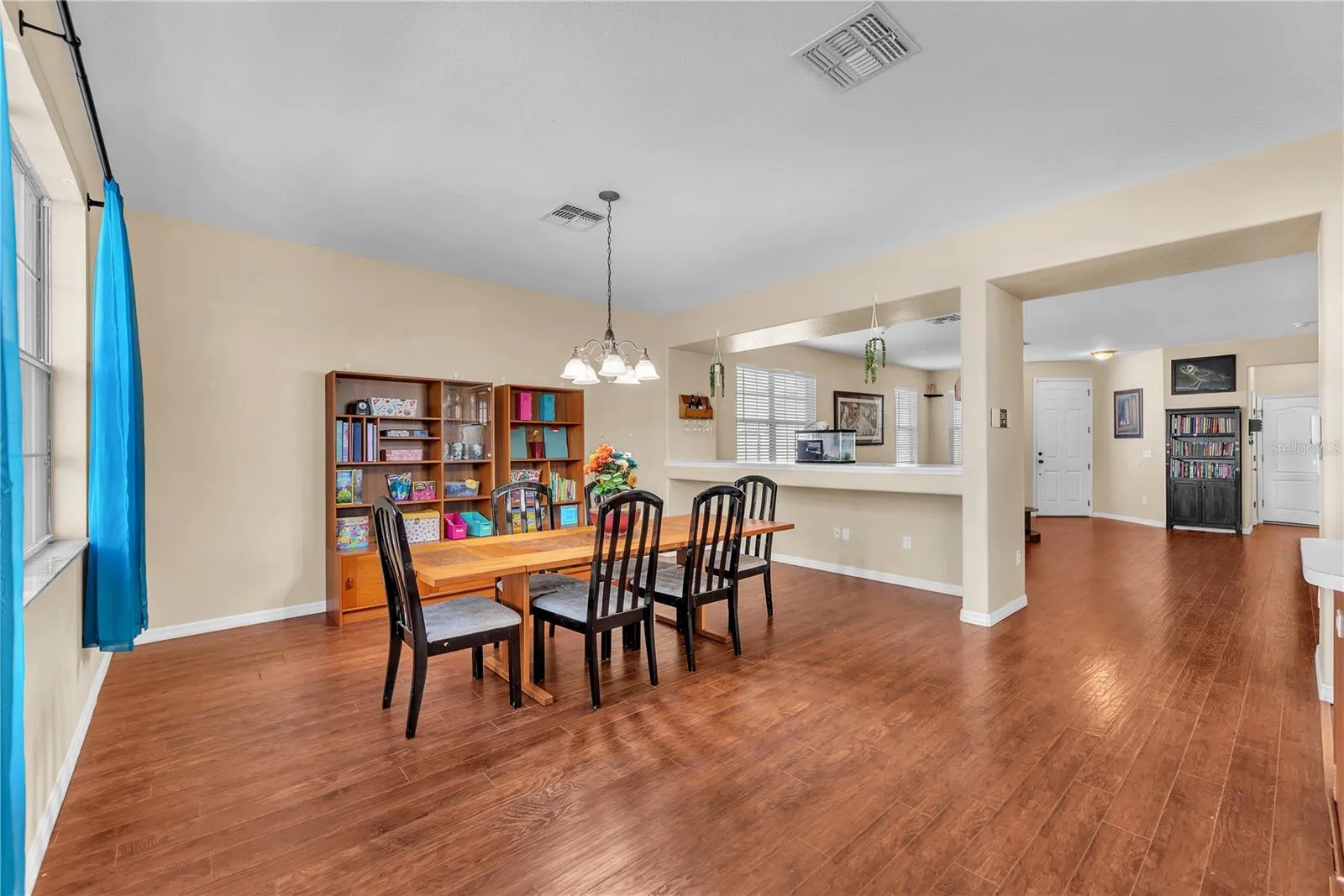 Separate dining and living areas with open sight lines that create a connected, inviting feel.