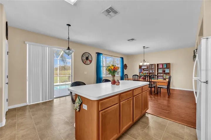 There is room for a casual dining table overlooking the backyard oasis.