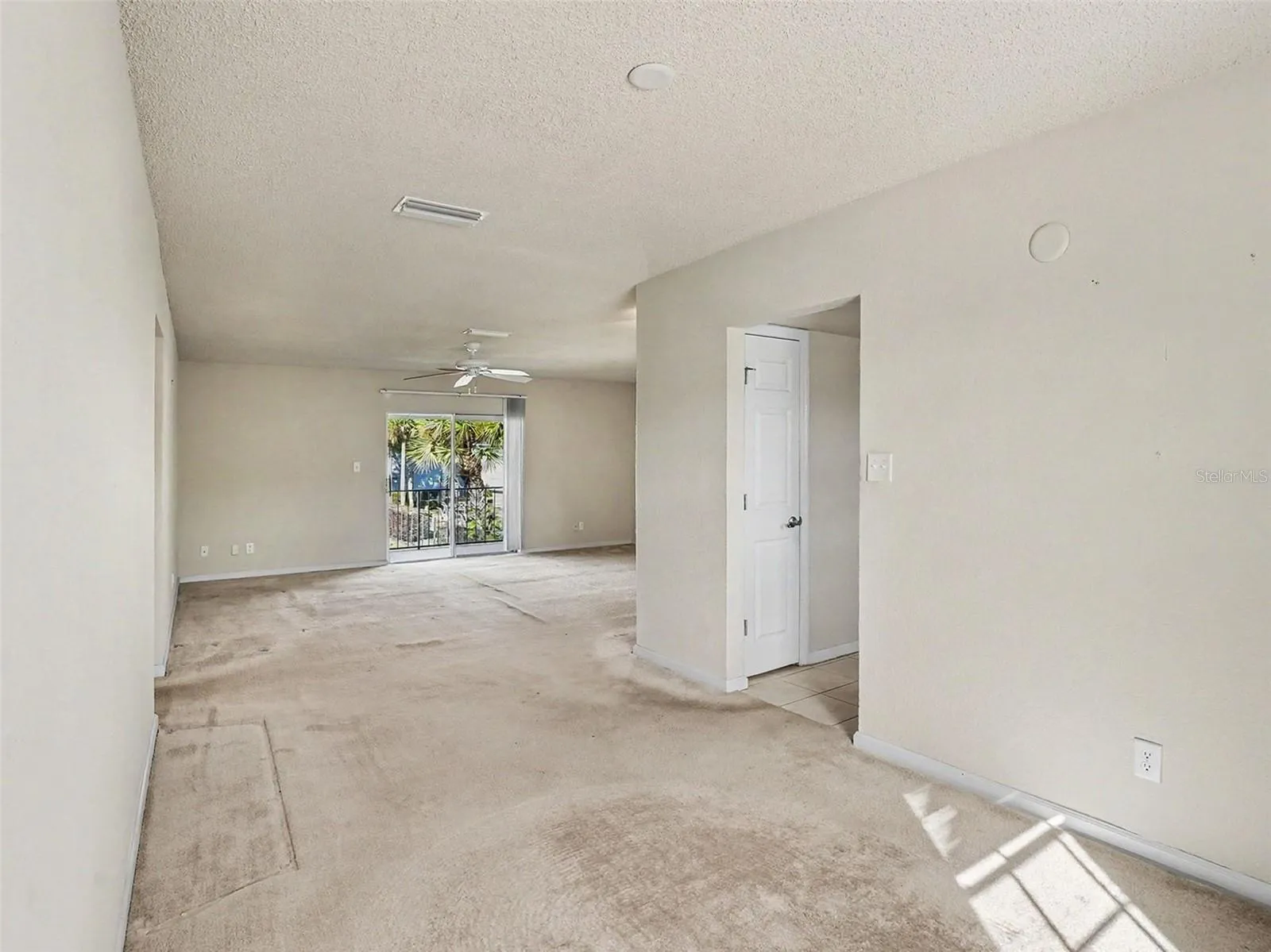 View from Dining to Living, Sliders to Balcony