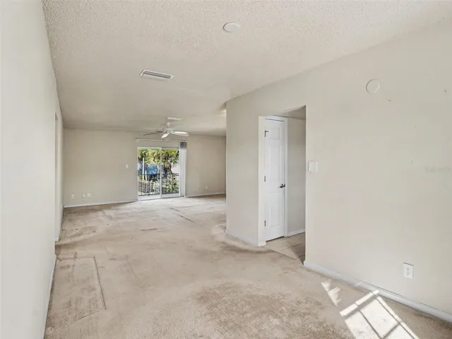 View from Dining to Living, Sliders to Balcony