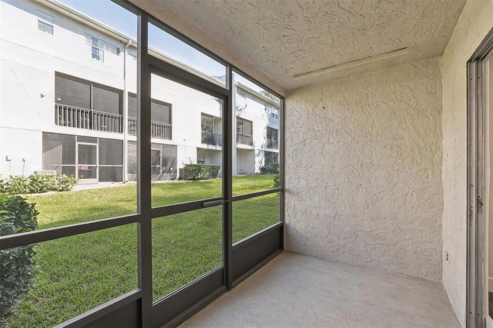 "Screened lanai with storage closet"