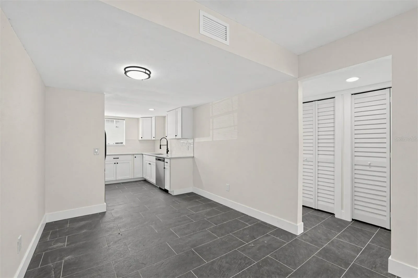 "Living area with sliding glass doors"