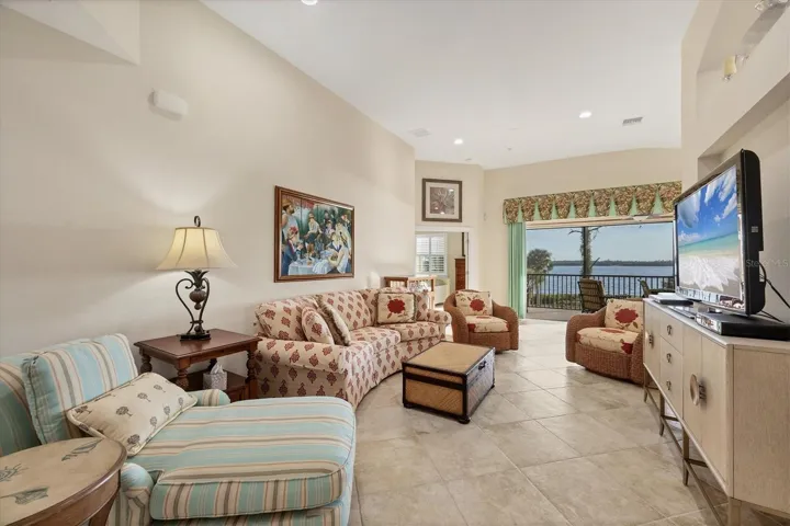 Living Room - View of screened porch/vaulted ceilings