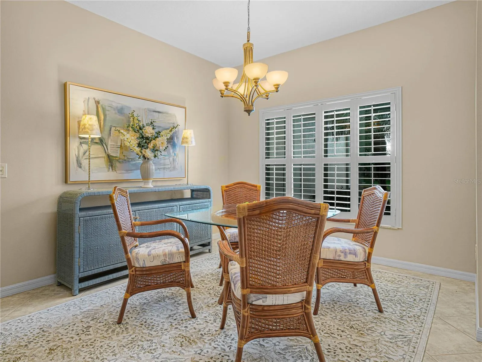 Formal Dining Area with Plantation Shutters and Upgraded Lighting Fixtures