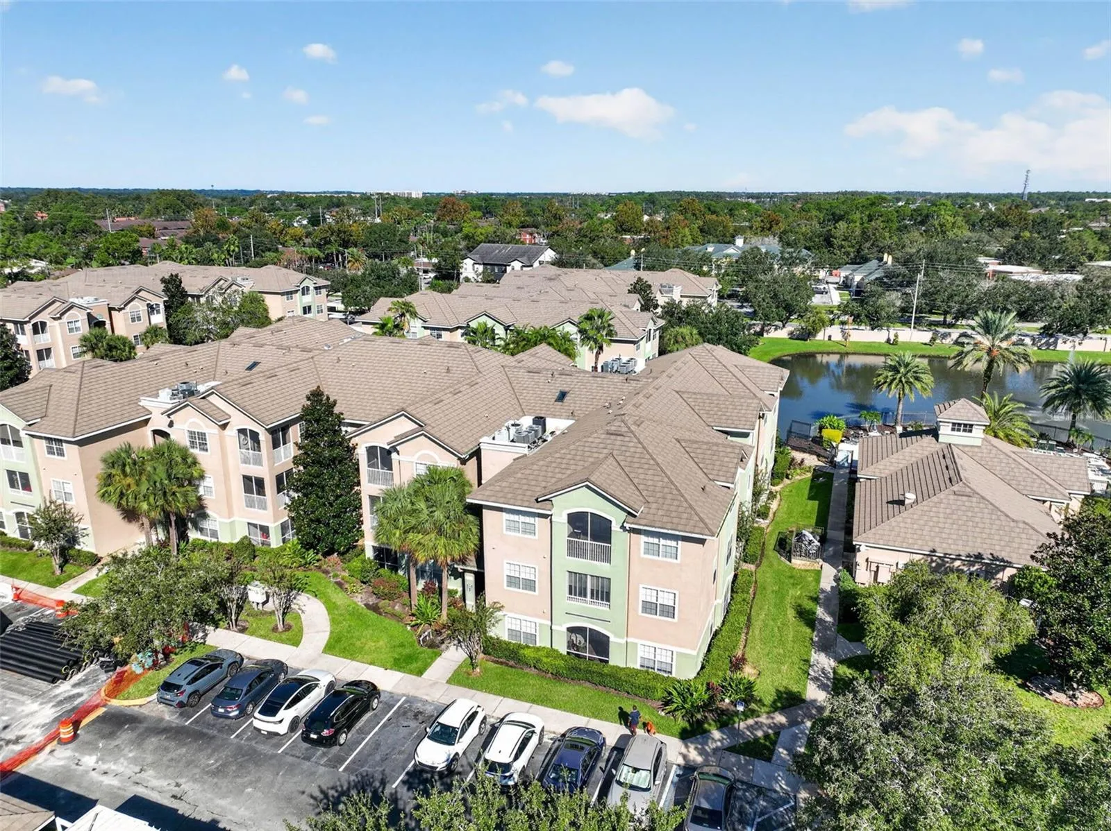 Aerial view of building, grounds and pond