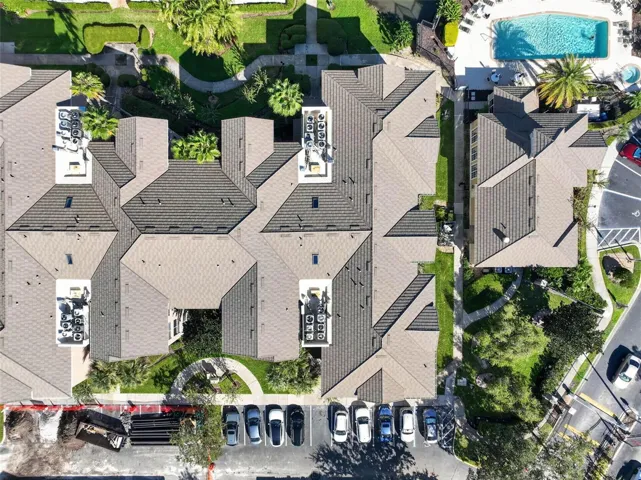 Top-down aerial of tile roof and community pool