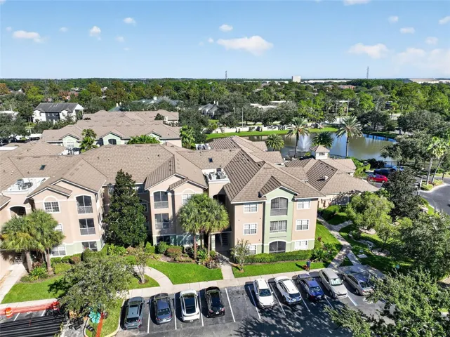 Aerial view of building front and parking