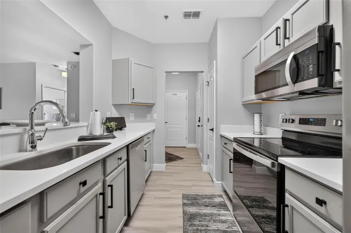 Kitchen sink with hallway beyond