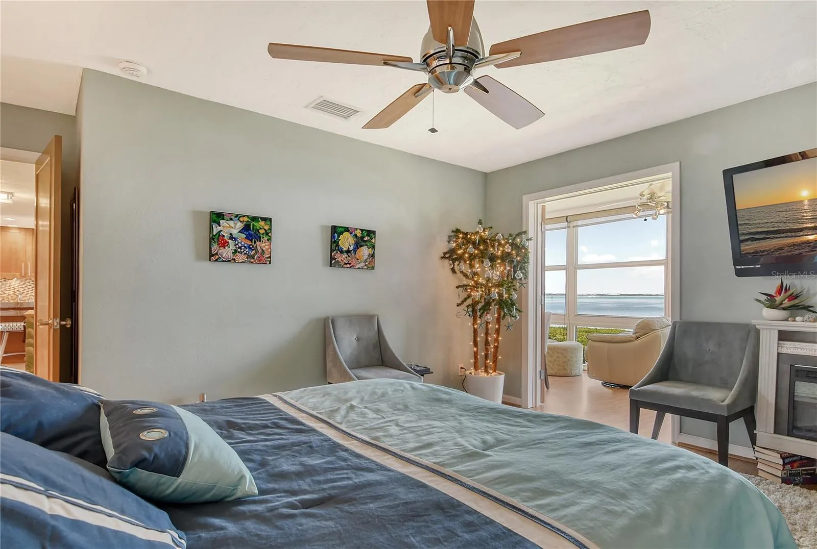 Primary Suite with Fireplace and Full Bayfront View!